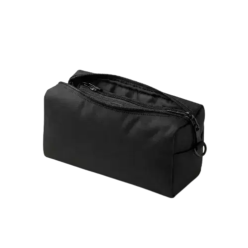 A rectangular black travel pouch is made of a textured fabric and has a small ring attached to the zipper pull.