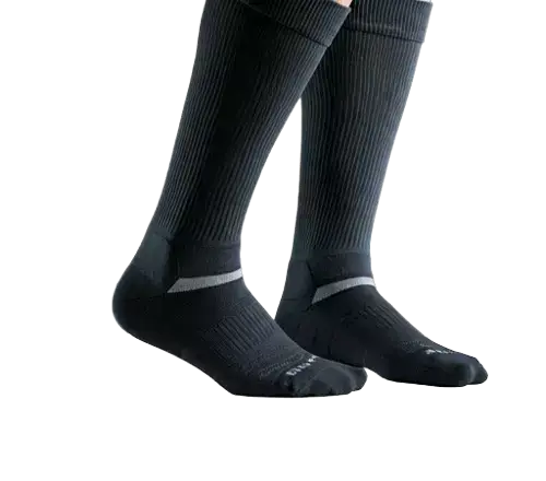 A pair of black compression socks are shown being worn on two legs, likely up to mid-calf.